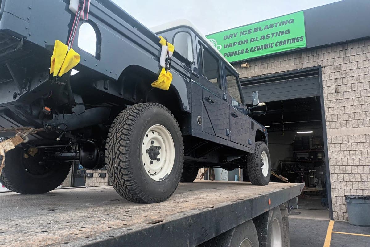 Finished Land Rover Defender loaded on the flatbed outside the RBSD shop in Hamilton