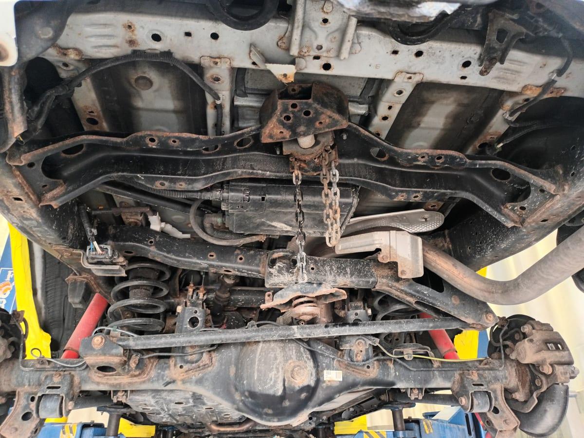 Toyota 4Runner underbody caked with road salt and surface rust before treatment at RBSD in Hamilton