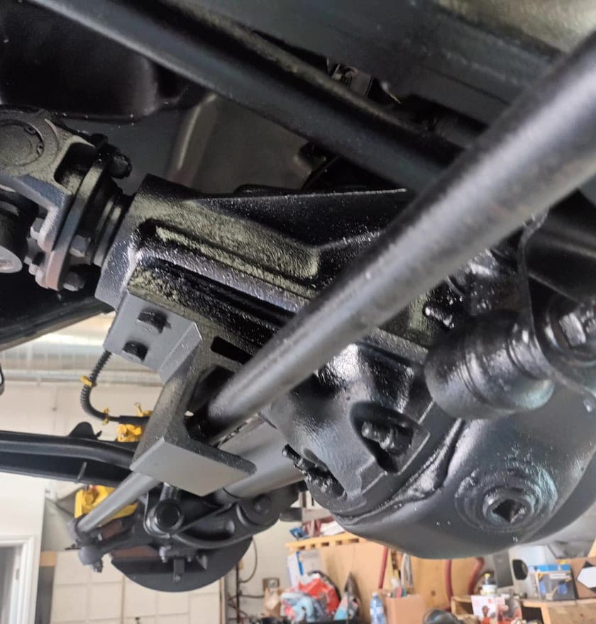 Defender rear axle and radius arm after coating