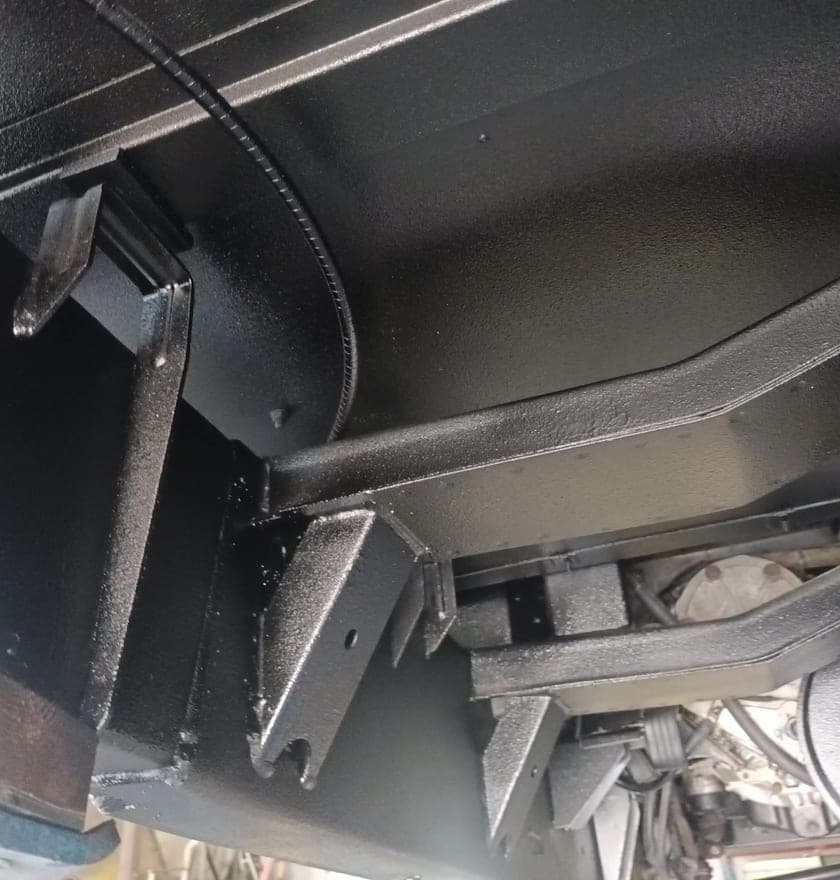 Defender chassis rail and body mounts after coating