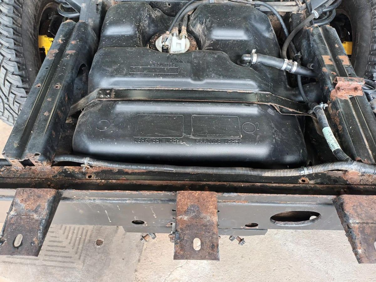 Defender fuel tanks and chassis rails part way through a dry ice blast